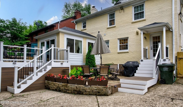 2417 Meadow Rd, Seneca Gardens, KY 40205 - rear view of house with a chimney, a patio, and a wooden deck