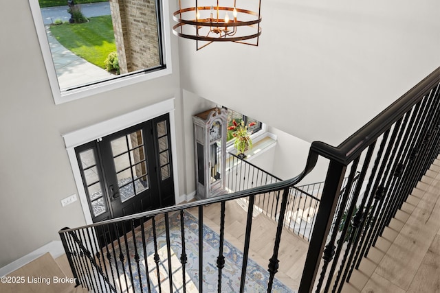5404 River Creek Ct, Prospect, KY 40059 - stairs featuring a chandelier, wood finished floors, and a towering ceiling
