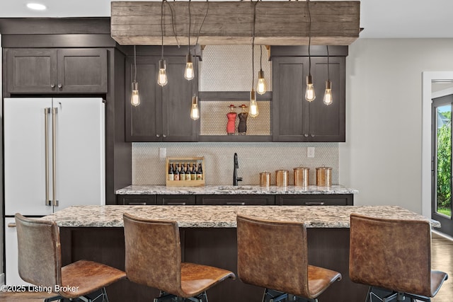 5404 River Creek Ct, Prospect, KY 40059 - bar with tasteful backsplash, freestanding refrigerator, and pendant lighting