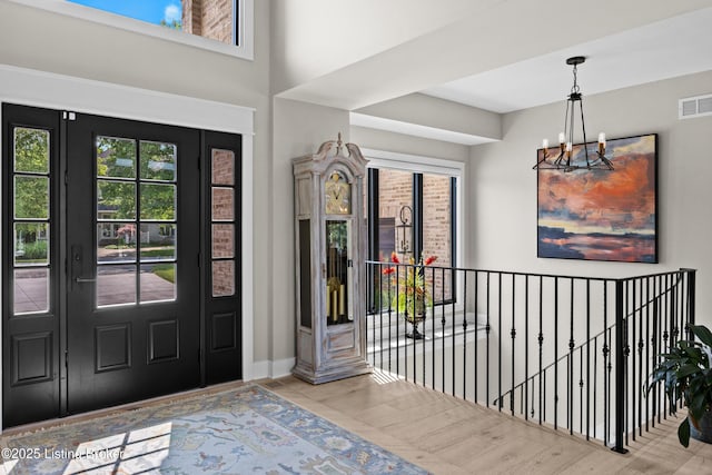 5404 River Creek Ct, Prospect, KY 40059 - foyer featuring a chandelier, wood finished floors, and a towering ceiling