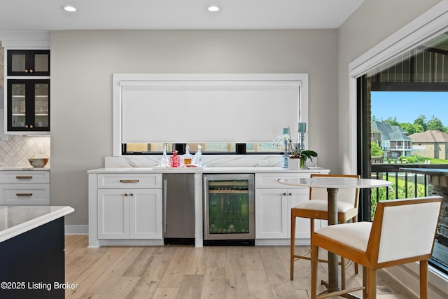 5404 River Creek Ct, Prospect, KY 40059 - bar featuring beverage cooler, decorative backsplash, light wood-style floors, recessed lighting, and refrigerator