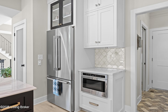 5404 River Creek Ct, Prospect, KY 40059 - kitchen with high quality fridge, decorative backsplash, white cabinets, and light stone countertops