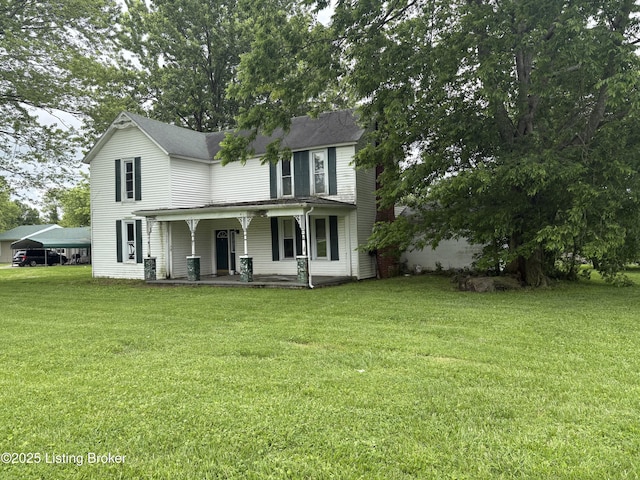 1535 Bardstown Rd, Hodgenville, KY 42748 - view of front of house with covered porch, a front lawn, and a carport