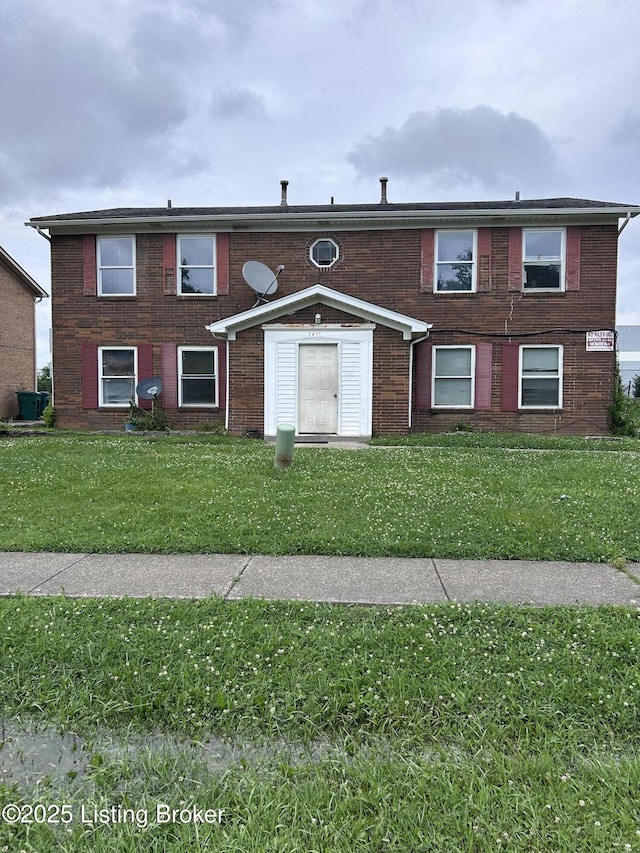 7415 Garrison Rd, Louisville, KY 40214 - view of front of home with a front yard and brick siding