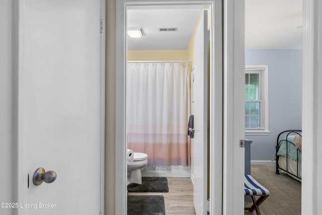7401 Maria Ave, Louisville, KY 40222 - bathroom featuring toilet and curtained shower