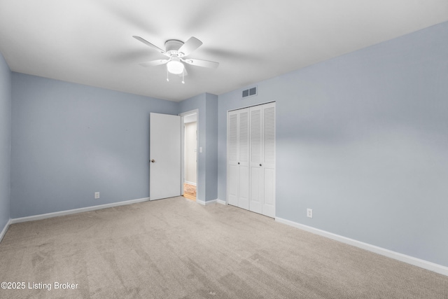 7401 Maria Ave, Louisville, KY 40222 - unfurnished bedroom with carpet, a closet, and a ceiling fan