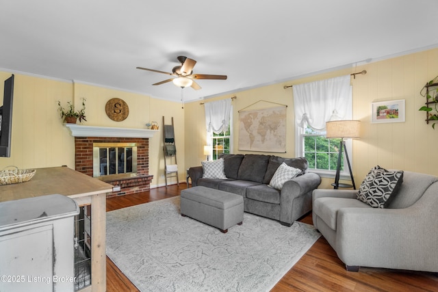 7401 Maria Ave, Louisville, KY 40222 - living room with wood finished floors, ceiling fan, crown molding, and a brick fireplace