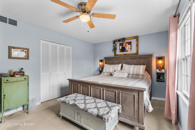 7401 Maria Ave, Louisville, KY 40222 - bedroom with light colored carpet, a closet, and a ceiling fan