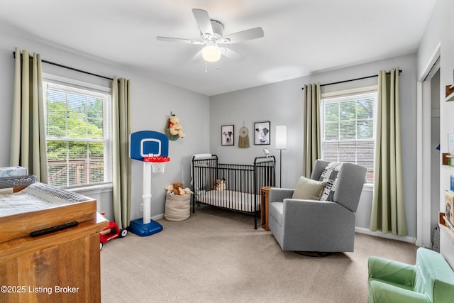 7401 Maria Ave, Louisville, KY 40222 - bedroom with carpet flooring, multiple windows, a nursery area, and ceiling fan