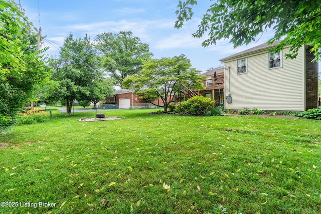 7401 Maria Ave, Louisville, KY 40222 - view of yard featuring a fire pit and a wooden deck