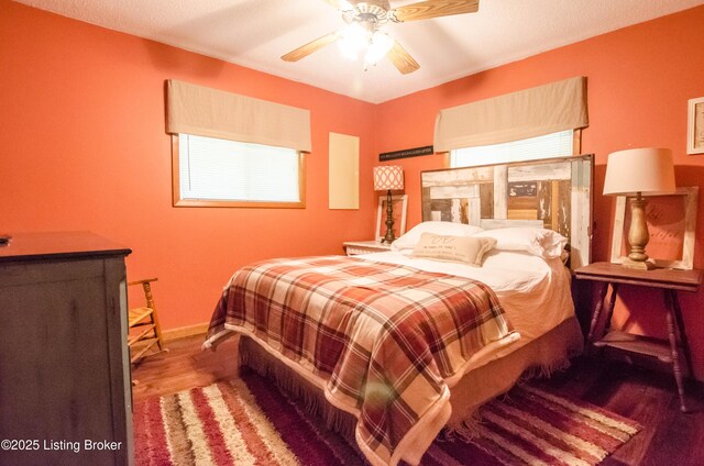 52 Lakeshore Cir, Leitchfield, KY 42754 - bedroom featuring multiple windows, wood finished floors, and ceiling fan