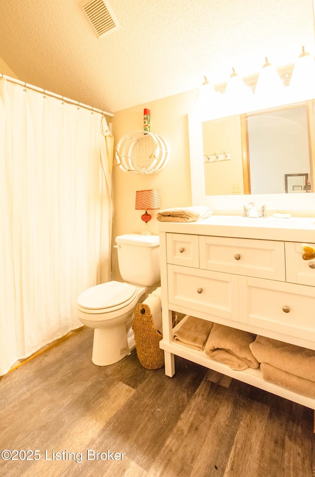 52 Lakeshore Cir, Leitchfield, KY 42754 - full bathroom with wood finished floors, vanity, a textured ceiling, and a shower with shower curtain