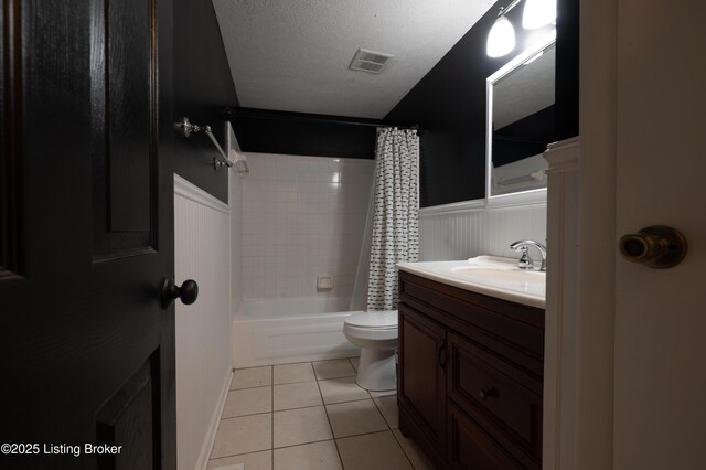 7215 Applegate Ln, Louisville, KY 40228 - full bathroom with tile patterned floors, vanity, shower / bath combo, toilet, and wainscoting