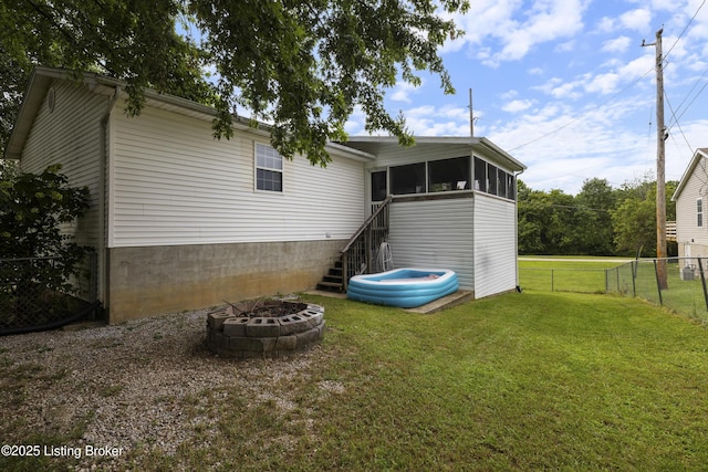 1108 Palisades Dr, Frankfort, KY 40601 - rear view of house featuring a sunroom, stairs, and a fire pit