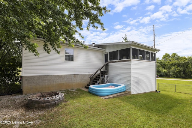 1108 Palisades Dr, Frankfort, KY 40601 - rear view of house with a sunroom, stairway, and an outdoor fire pit