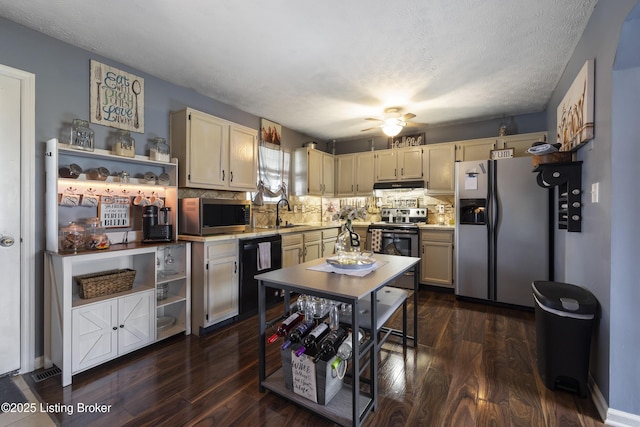 1108 Palisades Dr, Frankfort, KY 40601 - kitchen featuring stainless steel appliances, open shelves, under cabinet range hood, light countertops, and dark wood-type flooring