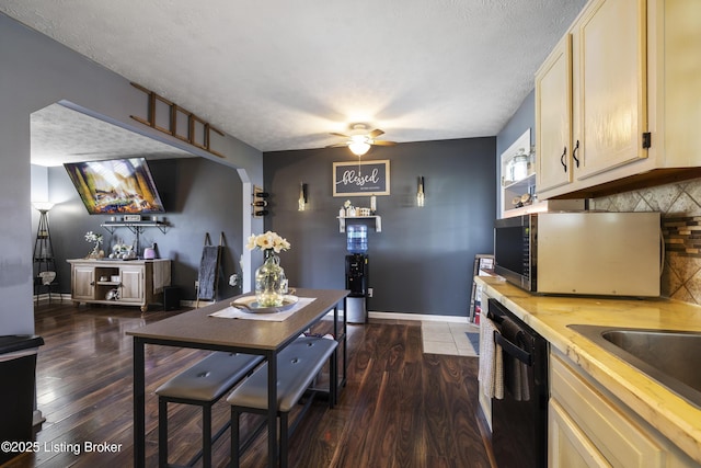 1108 Palisades Dr, Frankfort, KY 40601 - kitchen with stainless steel microwave, black dishwasher, backsplash, a ceiling fan, and dark wood-style floors