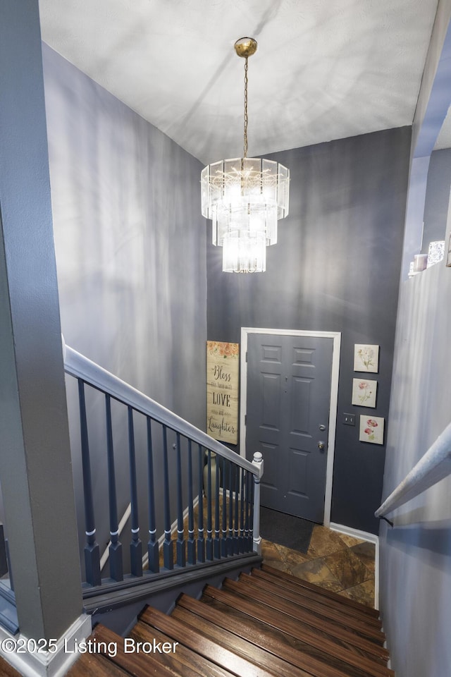 1108 Palisades Dr, Frankfort, KY 40601 - entryway featuring stairway, a chandelier, and stone finish floors
