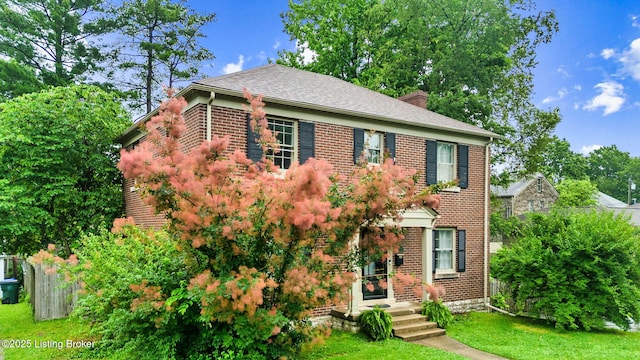 213 Barberry Ln, Lexington, KY 40503 - view of front facade with brick siding, a chimney, and a shingled roof