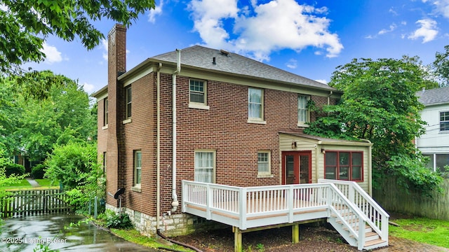 213 Barberry Ln, Lexington, KY 40503 - back of property with a chimney, a deck, and brick siding