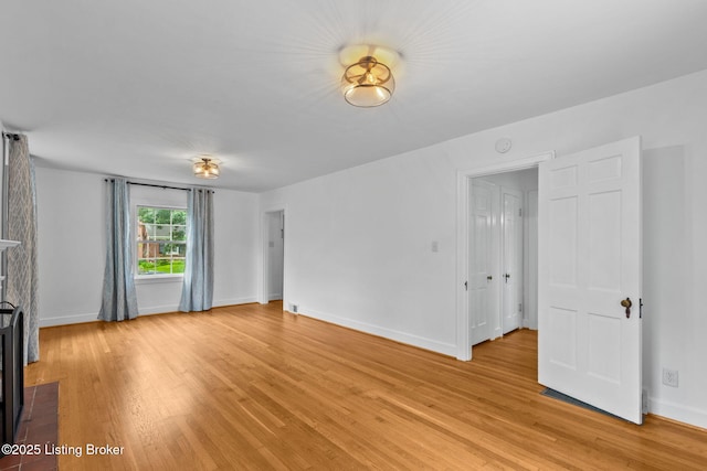 213 Barberry Ln, Lexington, KY 40503 - unfurnished living room featuring light wood-style flooring, baseboards, and a fireplace