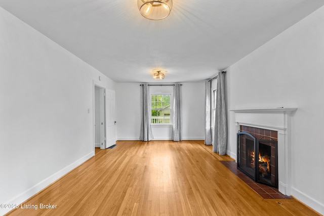 213 Barberry Ln, Lexington, KY 40503 - unfurnished living room with a fireplace, light wood-style floors, and baseboards