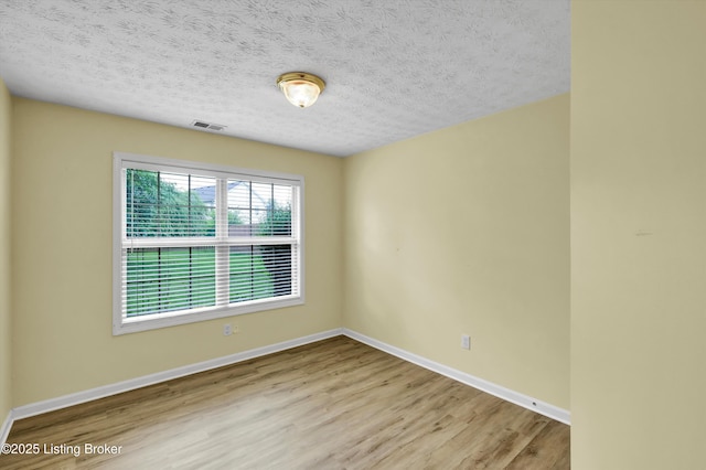 8405 Adams Run Rd, Louisville, KY 40228 - unfurnished room featuring wood finished floors, baseboards, and a textured ceiling