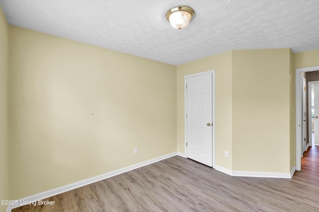8405 Adams Run Rd, Louisville, KY 40228 - unfurnished room featuring wood finished floors, baseboards, and a textured ceiling