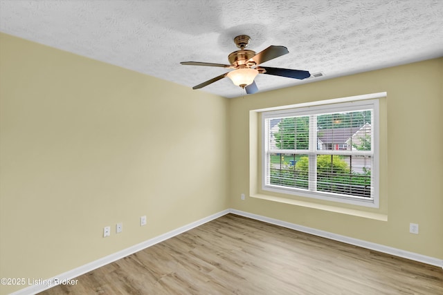 8405 Adams Run Rd, Louisville, KY 40228 - spare room with baseboards, wood finished floors, a textured ceiling, and ceiling fan