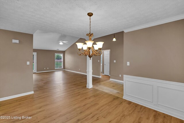 8405 Adams Run Rd, Louisville, KY 40228 - unfurnished dining area with a chandelier, light wood finished floors, ceiling fan, a textured ceiling, and vaulted ceiling