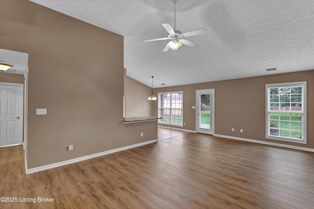 8405 Adams Run Rd, Louisville, KY 40228 - unfurnished living room with wood finished floors, baseboards, a ceiling fan, a chandelier, and high vaulted ceiling