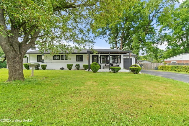 1709 Wickham Way, Louisville, KY 40223 - ranch-style house featuring asphalt driveway, a garage, and a porch