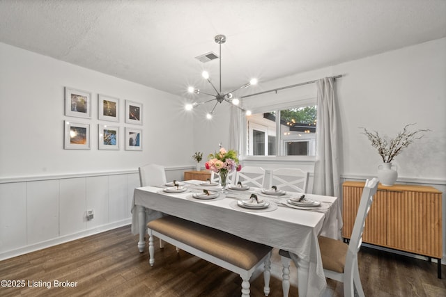 1709 Wickham Way, Louisville, KY 40223 - dining area featuring radiator heating unit, wood finished floors, a chandelier, and a wainscoted wall
