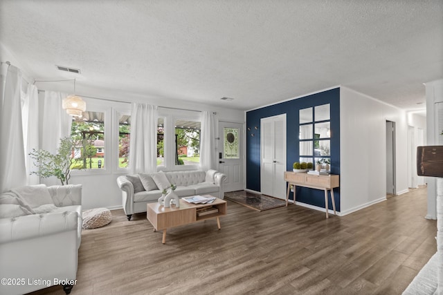 1709 Wickham Way, Louisville, KY 40223 - living room with a textured ceiling, wood finished floors, and baseboards