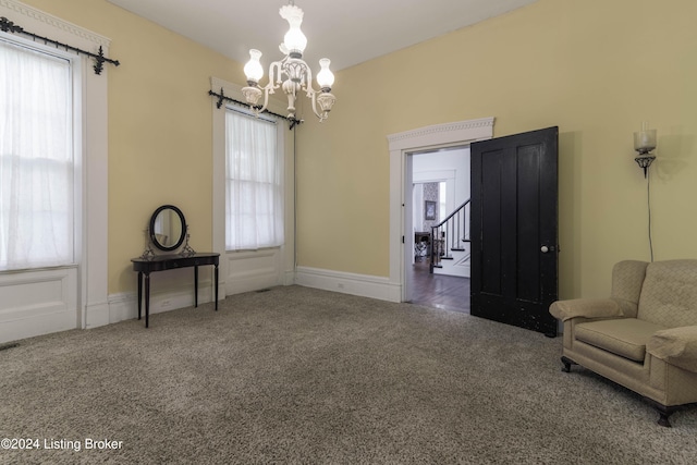 4893 N Preston Way, Shepherdsville, KY 40165 - living area with carpet, a chandelier, healthy amount of natural light, and stairs