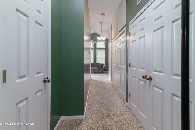 4893 N Preston Way, Shepherdsville, KY 40165 - hallway featuring carpet flooring, a chandelier, and baseboards