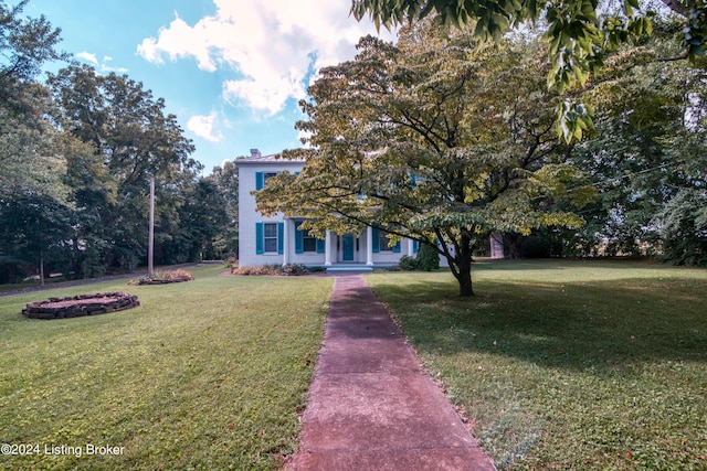 4893 N Preston Way, Shepherdsville, KY 40165 - view of property hidden behind natural elements featuring a front lawn and a chimney