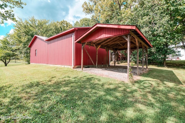 4893 N Preston Way, Shepherdsville, KY 40165 - view of pole building with driveway, a yard, and a detached carport
