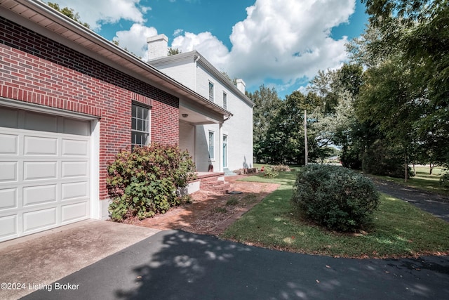 4893 N Preston Way, Shepherdsville, KY 40165 - view of property exterior featuring a chimney and brick siding