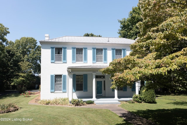 4893 N Preston Way, Shepherdsville, KY 40165 - view of front facade featuring covered porch, a chimney, a front lawn, metal roof, and a standing seam roof