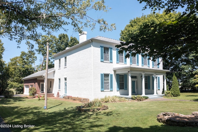 4893 N Preston Way, Shepherdsville, KY 40165 - view of front facade featuring a porch, a chimney, a front yard, and a garage
