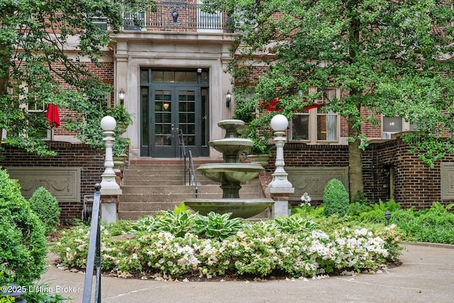 1412 Willow Ave Unit 56, Louisville, KY 40204 - property entrance featuring french doors, brick siding, and a balcony