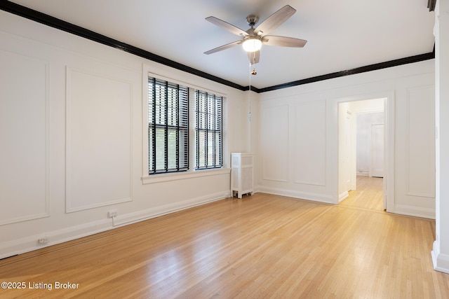 1412 Willow Ave Unit 56, Louisville, KY 40204 - spare room featuring a decorative wall, ceiling fan, light wood finished floors, and ornamental molding