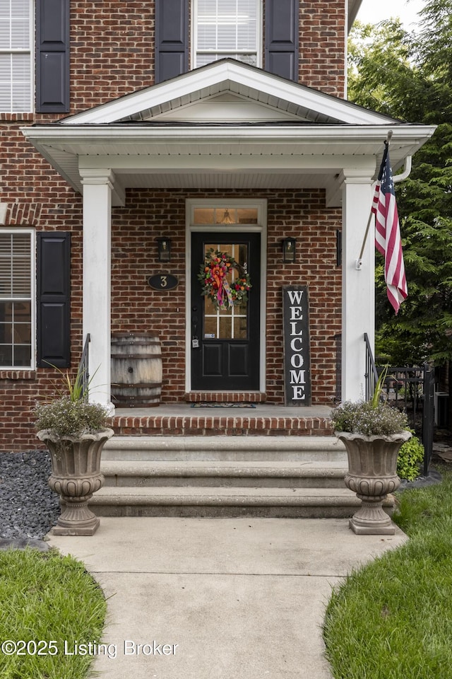 895 Woodlawn Rd Unit 3, Bardstown, KY 40004 - view of exterior entry with brick siding and a porch