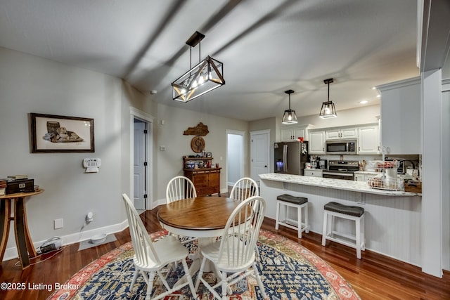 895 Woodlawn Rd Unit 3, Bardstown, KY 40004 - dining area with dark wood-style flooring, baseboards, and a chandelier