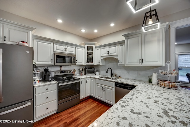 895 Woodlawn Rd Unit 3, Bardstown, KY 40004 - kitchen featuring appliances with stainless steel finishes, a sink, decorative backsplash, wood finished floors, and recessed lighting