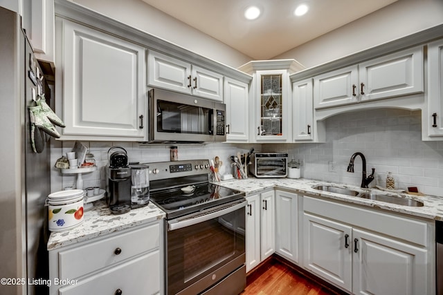 895 Woodlawn Rd Unit 3, Bardstown, KY 40004 - kitchen featuring stainless steel appliances, a sink, tasteful backsplash, glass insert cabinets, and light stone counters