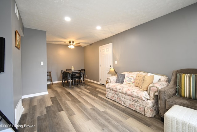 7050 Wildwood Cir Unit 100, Louisville, KY 40291 - living room featuring a ceiling fan, recessed lighting, and wood finished floors