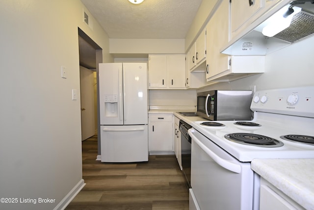 7050 Wildwood Cir Unit 100, Louisville, KY 40291 - kitchen featuring white appliances, under cabinet range hood, light countertops, dark wood-style floors, and a textured ceiling