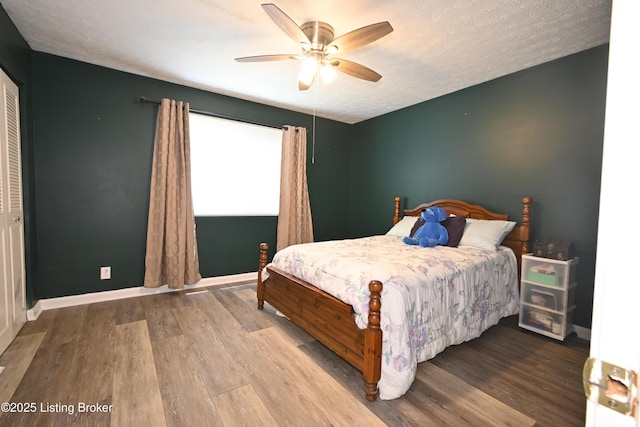 7050 Wildwood Cir Unit 100, Louisville, KY 40291 - bedroom with wood finished floors and a ceiling fan